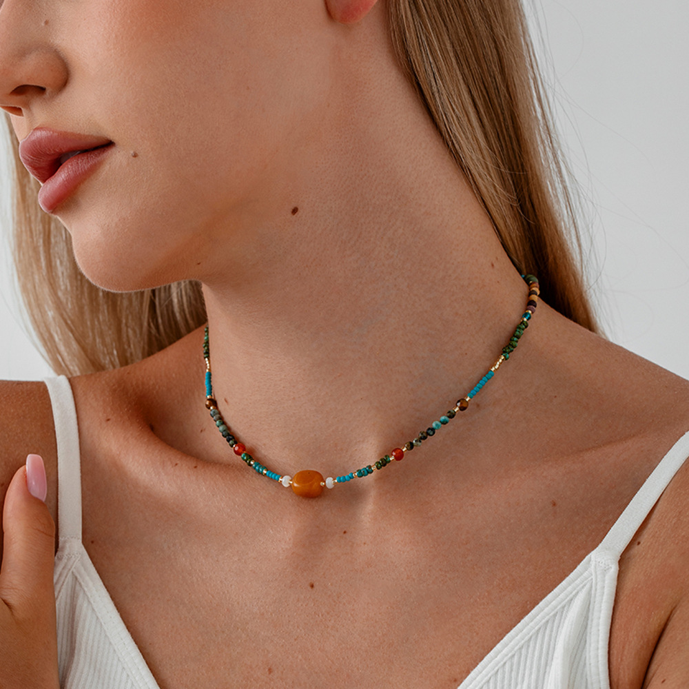 Model wearing natural stone necklaces